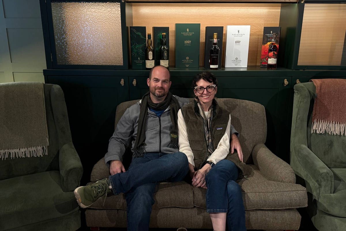Sam and Justin on a sofa in the Lagavulin tasting room